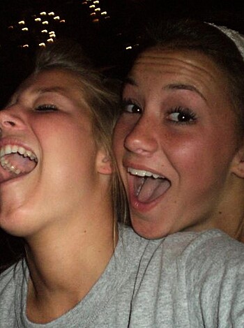 """
Two hot chicks cracking up while fucking around.
"""