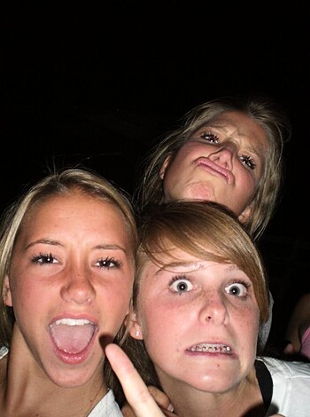 "Three hotties fucking around with their mugs for the camera."