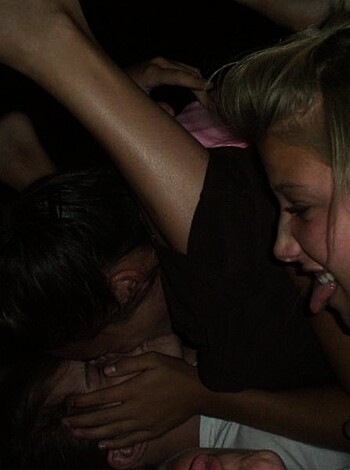 """
A bunch of fucking horny folks getting all up in each other's business, feeling each other up and shit. You can see their sweaty skin, tangled hair, and tight clothing that make it look like they're really into it. It's a raw as fuck moment caught on camera.
"""
