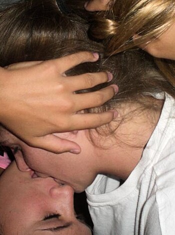 A threesome snogging hard while a chick in a white shirt fondles her mane, as she's on one knee in front of 'em, slobbering all over each other like rabid dogs in heat, fucking and sucking for all they're worth.