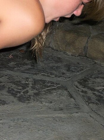 "Cracked-ass fuckin' granite floor with some broad's tits and cunt on display."