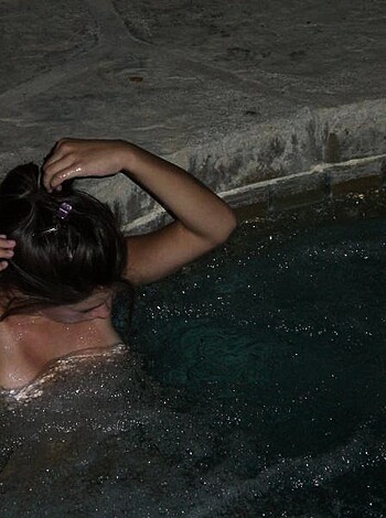 "Hey bros, check out this hot chick taking off her bracelet after fucking around in the pool naked."