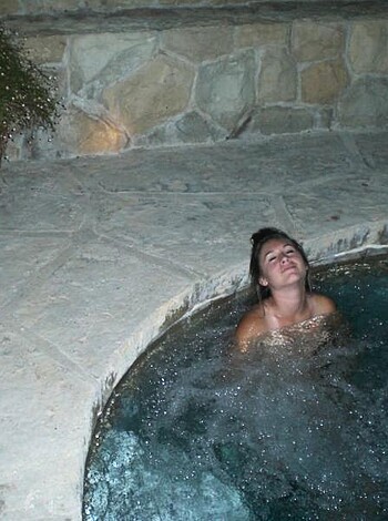 Here's a fuckin' picture of some hot chick soaking in a goddamn Jacuzzi, spreading her legs wide open for the world to see.