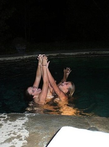 "Grab yo' balls and check out these two hoes bumpin' fists by a frickin' pool."
