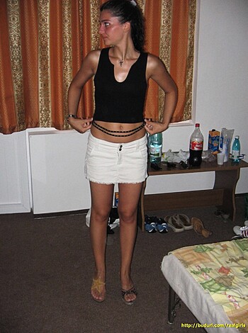 "Damn, this hot bitch is dressed like a fucking slut! Look at those tight black tits hanging out of her see-through top, while that skirt barely covers her pussy. And don't even get me started on that teeny tiny piece of fabric she calls a 'bikini bottom.' Damn, I wish I was that chick's fucking dildo."