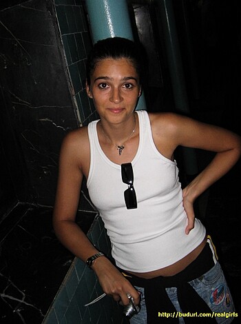 Vulgar Description: "This fucking bitch is wearing a see-through tank top, with her tits hanging out like she's some kind of porn star."