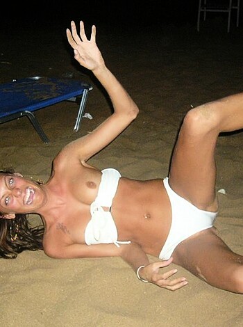 Vulgar Description: "Night time tits on the shore, bra-less broad spreading her mammaries."