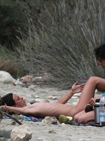 Two nudist lesbian girls on a beach in spain - Photo 14