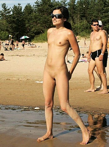 "Fucking hot naked babe strolls down the shore, sandy tits and pussy flopping in the wind while she wears only fucking sunglasses and fucking shoes."