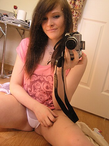 "Selfie-taking bitch sits on her ass and poses for the camera."
