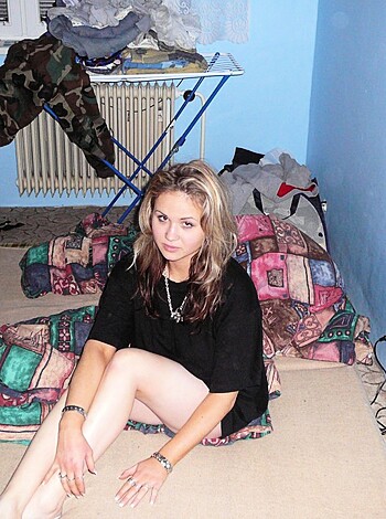 """
Bitch straddling her bed wearing daisy dukes and a tank top while she crosses her fucking legs, slutting it up like whoa.
"""