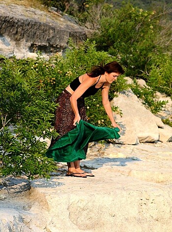 A hot girl in her late teens strips on the beach - Photo 1