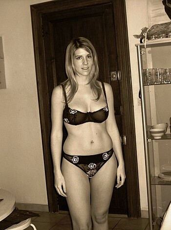 "Here's a fucking hot chick with her tits out and ass cheeks poked out wearing sexy panties."