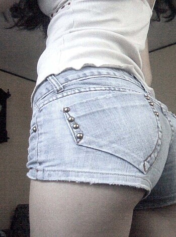 "Check out this bitch's ass in those tight denim daisy dukes with the fucking spikes sticking out of 'em, standing in some skanky-ass room."