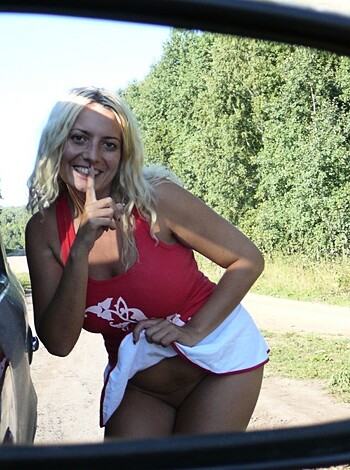 Here's a chick in a tight-assed red bathing suit suckin' on some fucking dude's dickmobile while she flips the bird at the camera like a total cuntmunch.