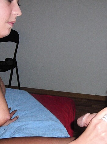 A f*cking dirty-assed picture of some chick rubbin' her titties on a dude sittin' down, with no clothes on.