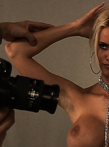 "Here's your average chick, busty as fuck, sportin' a tight-ass thong and some sweet jewelry, playin' to the camera like a total hottie."