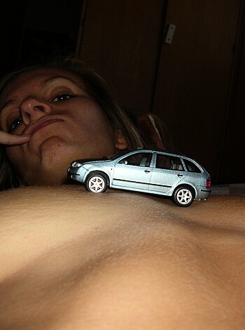 A fucking naked bitch's hand cupping her goddamn titties with pink little nips poking out.