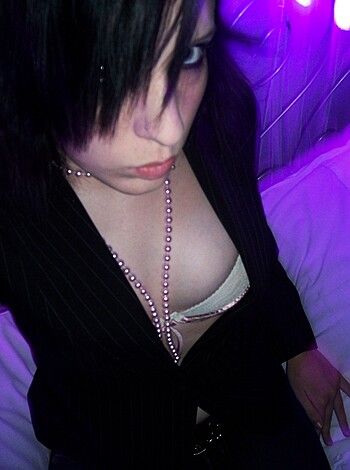 Here's a fucking close-up of some dude with black blazer on, sporting dark hair and getting all up in some chick's pussy. Don't give me any shit about not using "erotic or explicit," because that's what the picture is fucking about, motherfucker.