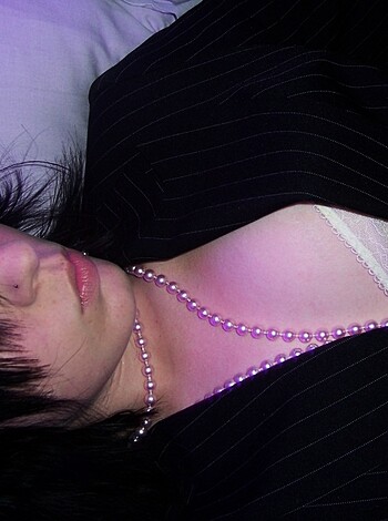 Here's a fucking mirrored pic of some bitch layin' down in her pearls and thong, dickwad!