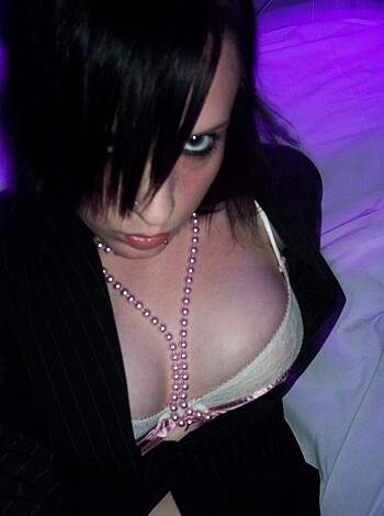 Here's the image of a slutty bitch with her tits hanging out, fucking ready for any dick that comes along.
