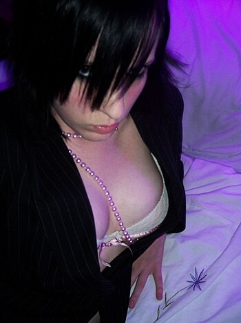 """
Fuckin' A! This here's a titillating titty twosome shot, bitch! Look at those fuckable funbags, all perky and puffy in some black lacy shit. Damn girl, you lookin' good enough to eat, with that beaded necklace hanging around your neck like a goddamn prize. Fuck me running, I'd sure as hell give 'em a suck or two if they were mine!
"""