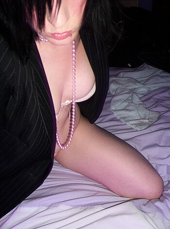 "Fuckin' hot bitch on her bed, draped in silky panties and a necklace."