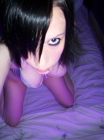 A naked bitch lying on a fucking bed.