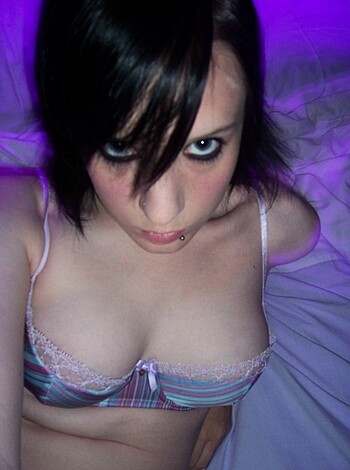 Fucking hot chick in lacy panties on her back with legs spread open for the camera.