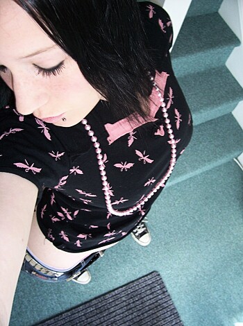 This here bitch is lookin' fucking hot with her tight as fuck ass wrapped up in that black tee, while her cunt's pourin' outta those pink panties like the sweetest of nectar!