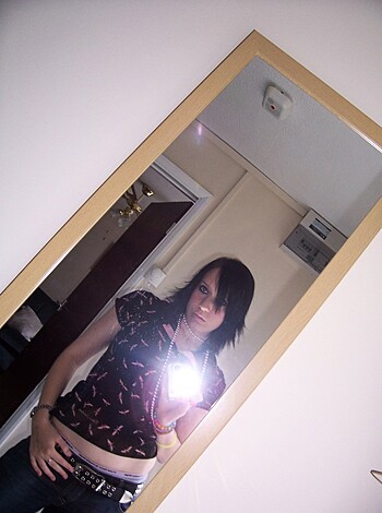 "Here's a fat bitch snapping a selfie in front of the mirror while showing off her shitty ass outfit."