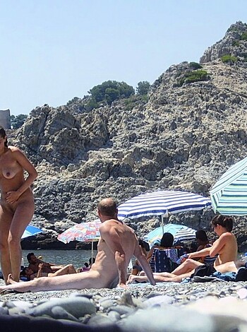 "Here's a fucking hot topless babe, casually strolling past some fat dickhead sunbathing nude on the goddamn rocks by the beach."