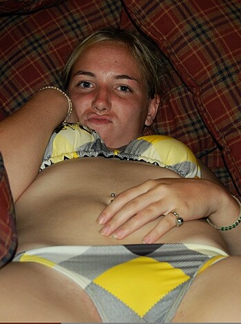 "This photo shows some skanky slut lying around in her skimpy bra and panties, with her fat tits and cellulite-ridden ass hanging out for all to see."