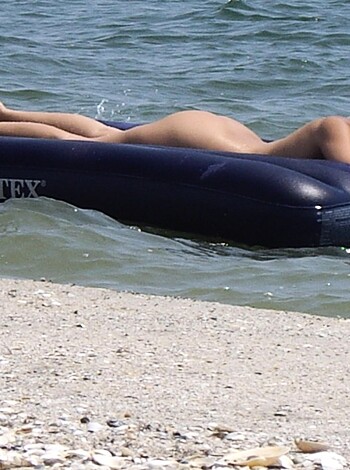 "Fucking hot chick floating around in the fucking ocean on a giant rubber dick, while her perfect body is exposed for all to see."