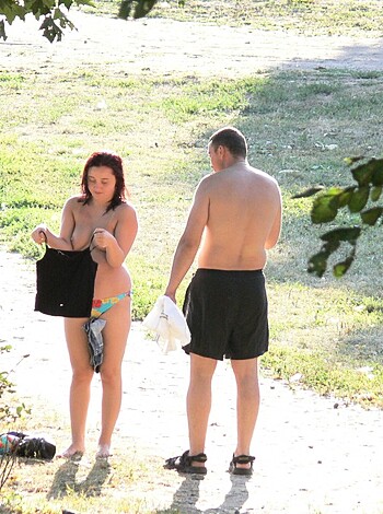 Vulgar description:
Dude and bitch with no clothes on fucking outside near some bushes.