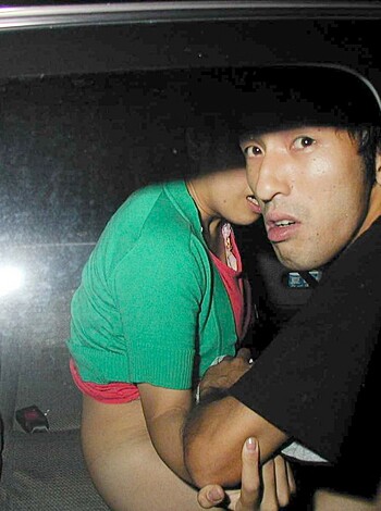 A man's dirty hand groping onto a woman's smooth thigh.