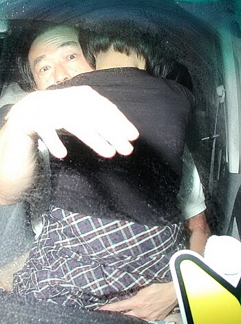 "Two dudes bumpin' fists in the backseat of a car, bro."