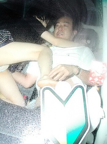 A couple goin at it in the backseat of a whip, gettin busy like they ain't got no shame.
