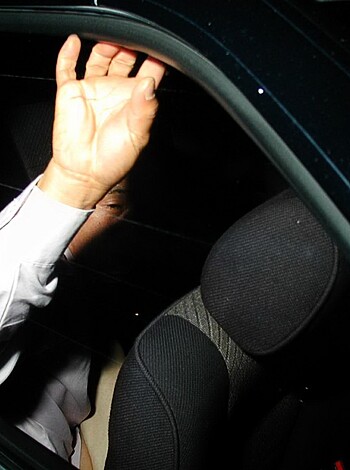 A sweaty fucker with his dick out is sticking his meaty hands onto the roof of a car.