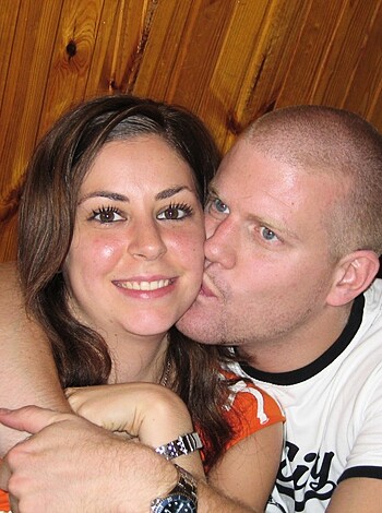 A fuckin' hot babe and her stud of a boyfriend gettin' all lovey-dovey for the cameras.