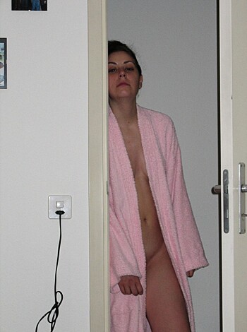 "Nude chick peeping through the door."