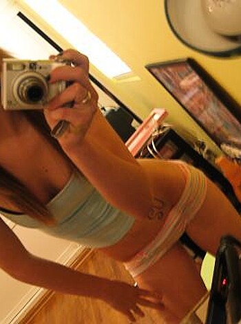 """
Horny bitch with tits and ass checking her shit out in the mirror.
""" 

Note: The limit is 30 words.