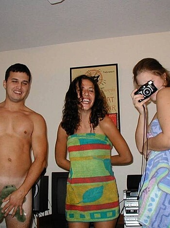 Fuckin' pissin' nigga with an average-sized dick showin' it off to a couple of bitches that were crackin' up while they took a pic.