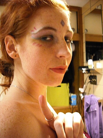 "This picture is a fuckin' snap of some dude with fuckin' face paint on, probly taken at some fuckin' dumbass party or shit where they're all dressed up like fuckin' retards. It don't say much about the dude, but it sure looks like he's havin' a fuckin' good time bein' a fuckin' moron."