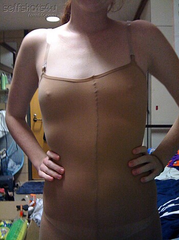 "This bitch is tryin' ta look sexy wit that shitty corset on! An' da fuck she think she doin'? Puttin' on dis show in some dirty-ass garage or somethin'? Bet she's got a bed an' all sorts a shit around her cuz dat's how hoes roll, ain't it? Fuckin' dumb bitch."