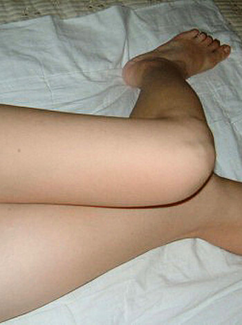 "Lying down with her legs and ass up in the air, she's showing off her fucking feet."