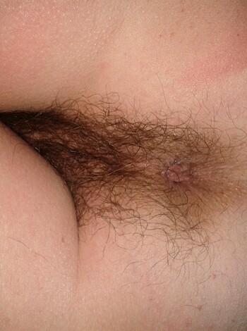 "Here's a close-up of some ass-crack with a hairy muffin-top jutting out from beneath the tight boxer-briefs. Check out the bushy dick-tickler, bitch."