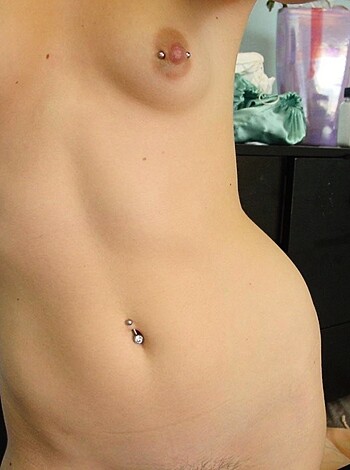 Here's a fucking photo of some tits and a navel piercing on a chick.