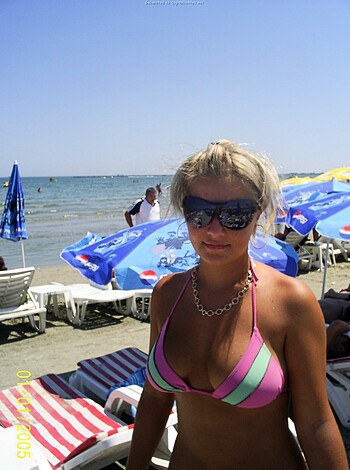 Busty blonde chick on the shore with her boobs exposed and a tiny thong on, while getting fucking sand everywhere.