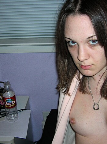 A chick's tits, sans brassiere, with pink nipples.